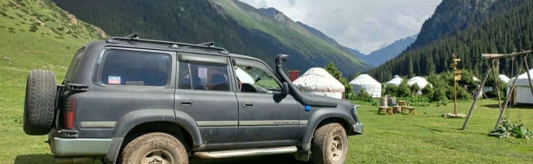 4x4 driving on a dirt road in the mountains